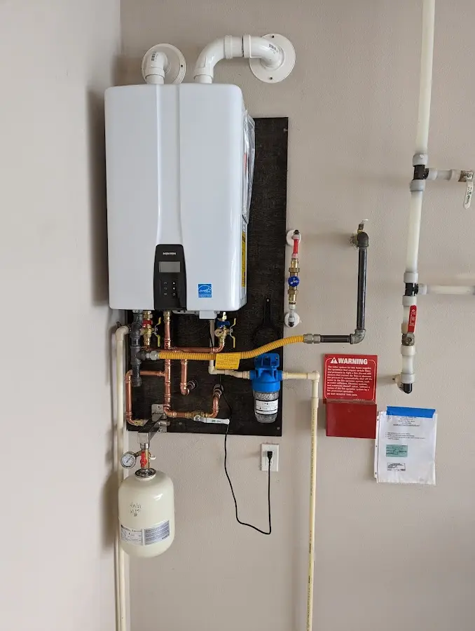 Professional plumber installing copper piping in a Calistoga home